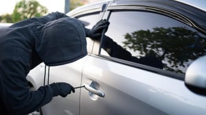 Man trying to break into luxury car